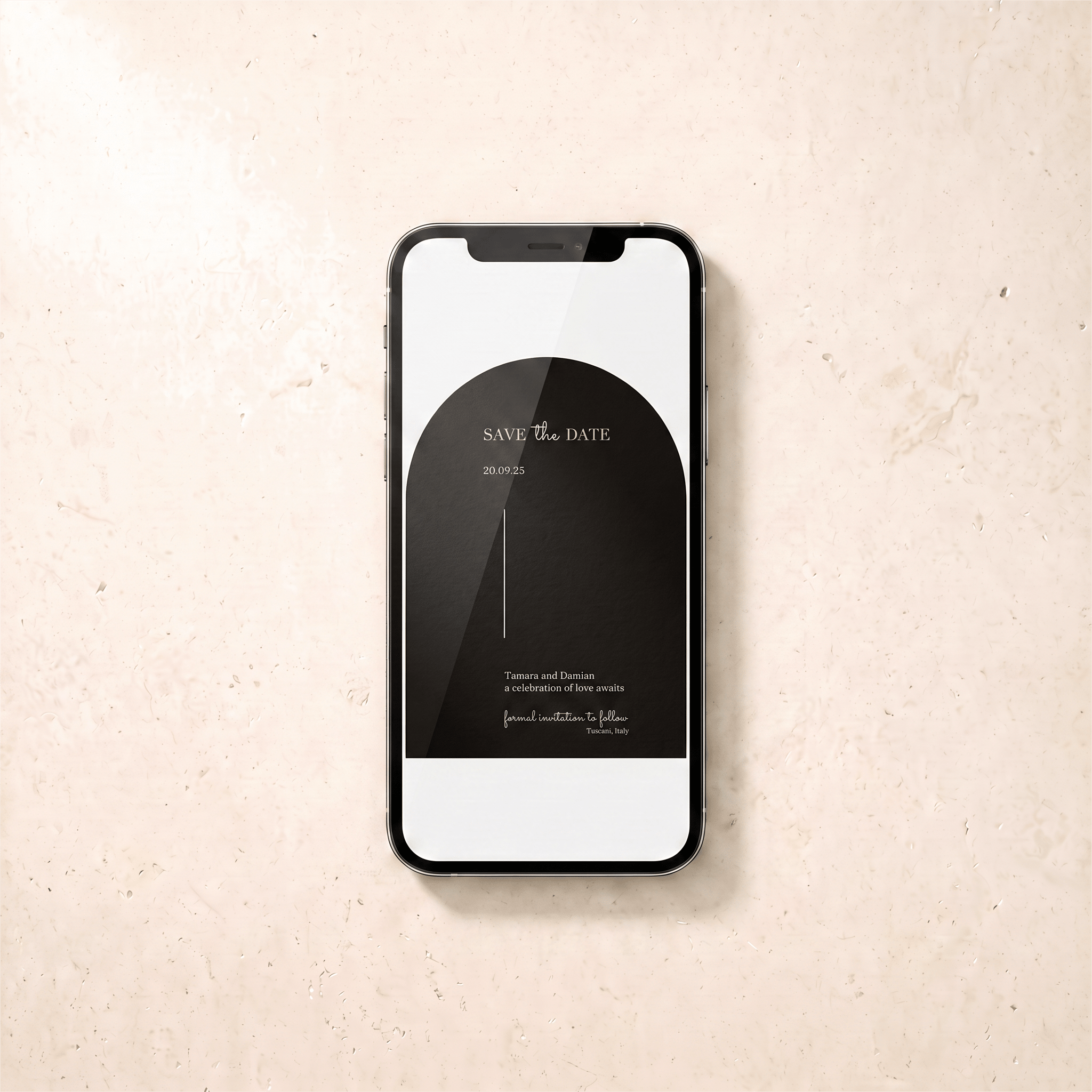 A black smartphone lying on a light beige textured surface, displaying a black minimalist 'Save the Date' card design on its screen.