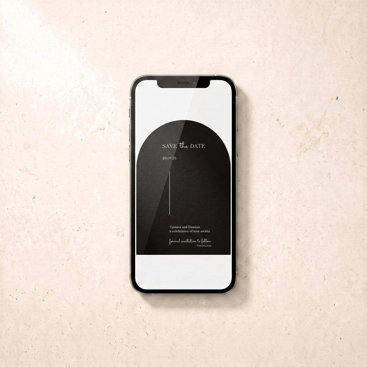 A black smartphone lying on a light beige textured surface, displaying a black minimalist 'Save the Date' card design on its screen.