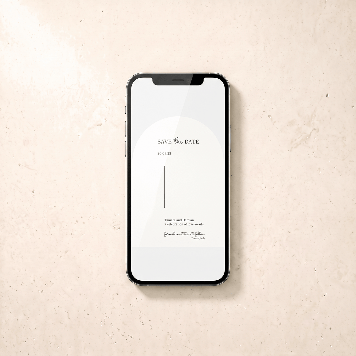 A black smartphone lying on a light beige textured surface, displaying a minimalist 'Save the Date' card design on its screen.