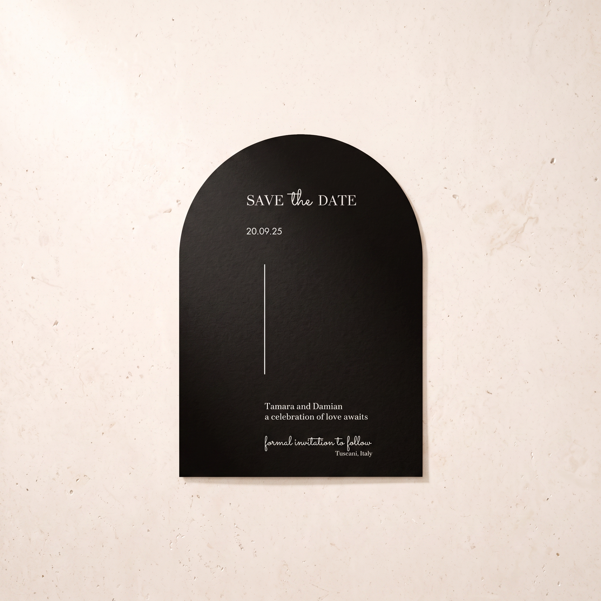 A black arched 'Save the Date' card with elegant white typography, displayed against a textured beige background.