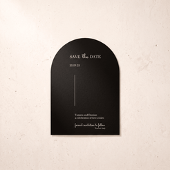 A black arched 'Save the Date' card with elegant white typography, displayed against a textured beige background.
