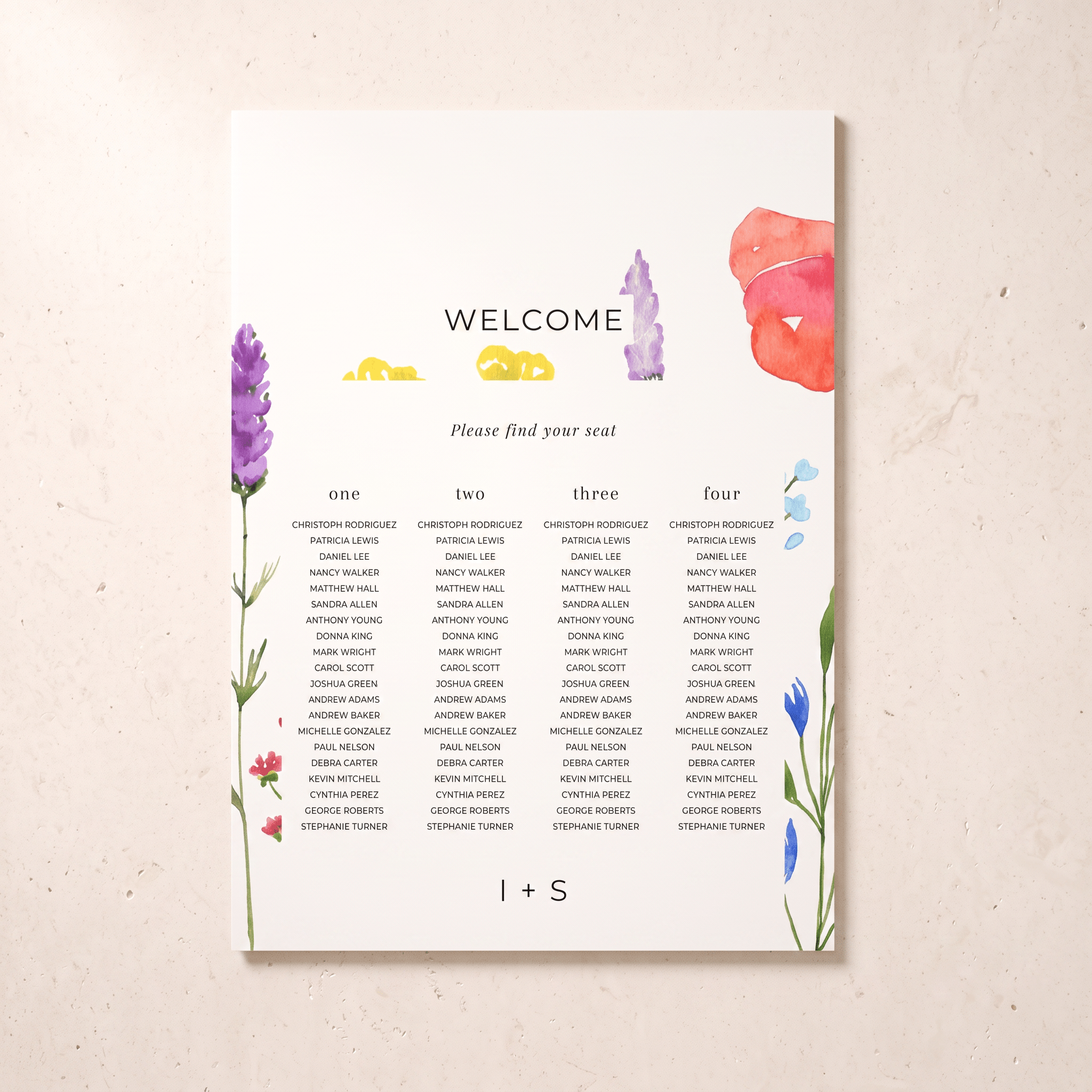 A wedding welcome seating chart print with floral watercolor accents in purple, yellow, pink, and blue, displayed on a textured beige background.