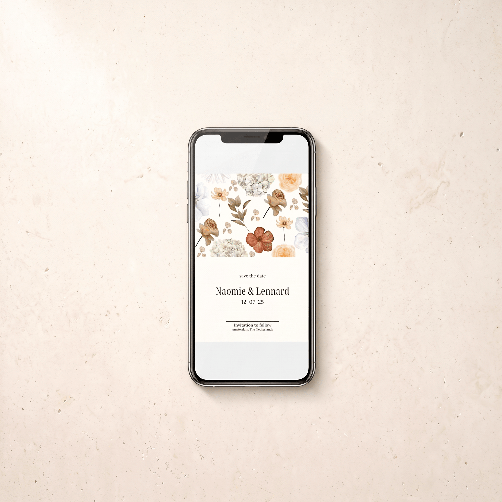 A smartphone centered on a light beige textured surface, displaying a wedding save-the-date card design with floral illustrations and the names Naomi & Lennard with the date 12-07-25.