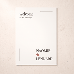 A minimalist wedding welcome card with black text reading 'welcome to our wedding' and the names 'NAOMIE' and 'LENNARD' separated by a small pink flower, shown on a light beige textured background.