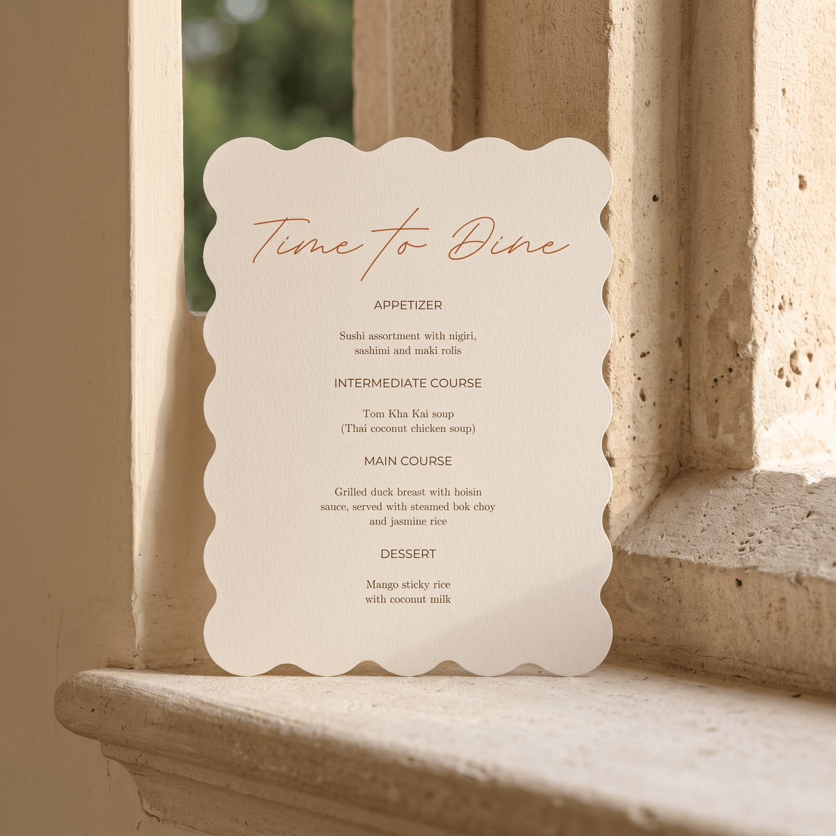 A scalloped-edge menu card reading 'Time to Dine' in elegant script, placed on a stone windowsill with warm beige stone architecture in the background.