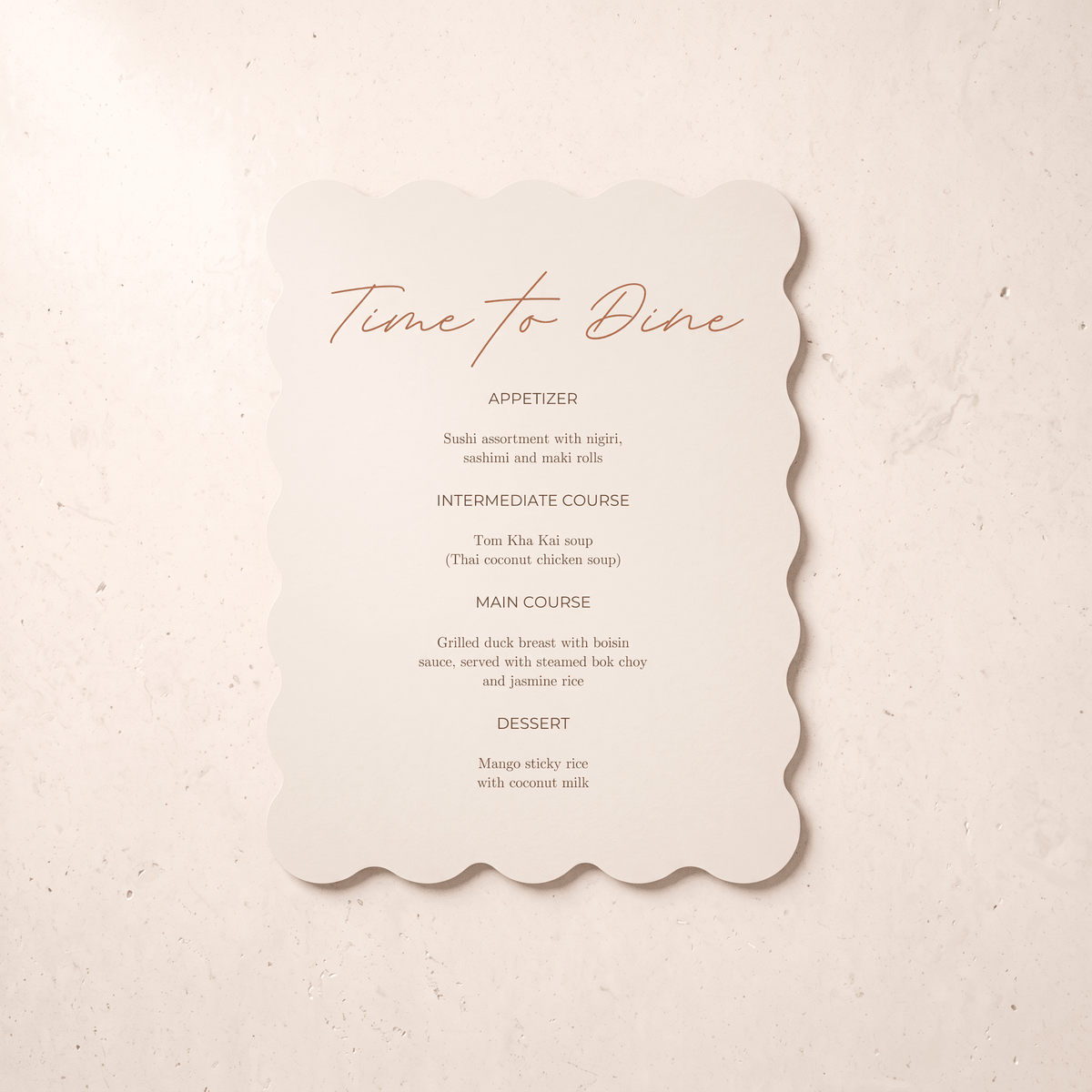 A scalloped cream paper menu card with orange script and black text reading 'Time to Dine' and course listings, placed on a light beige textured surface.