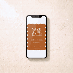 A smartphone lying on a light beige textured surface, displaying a brown and white 'Save Our Date' invitation design with scalloped edges and wedding text.