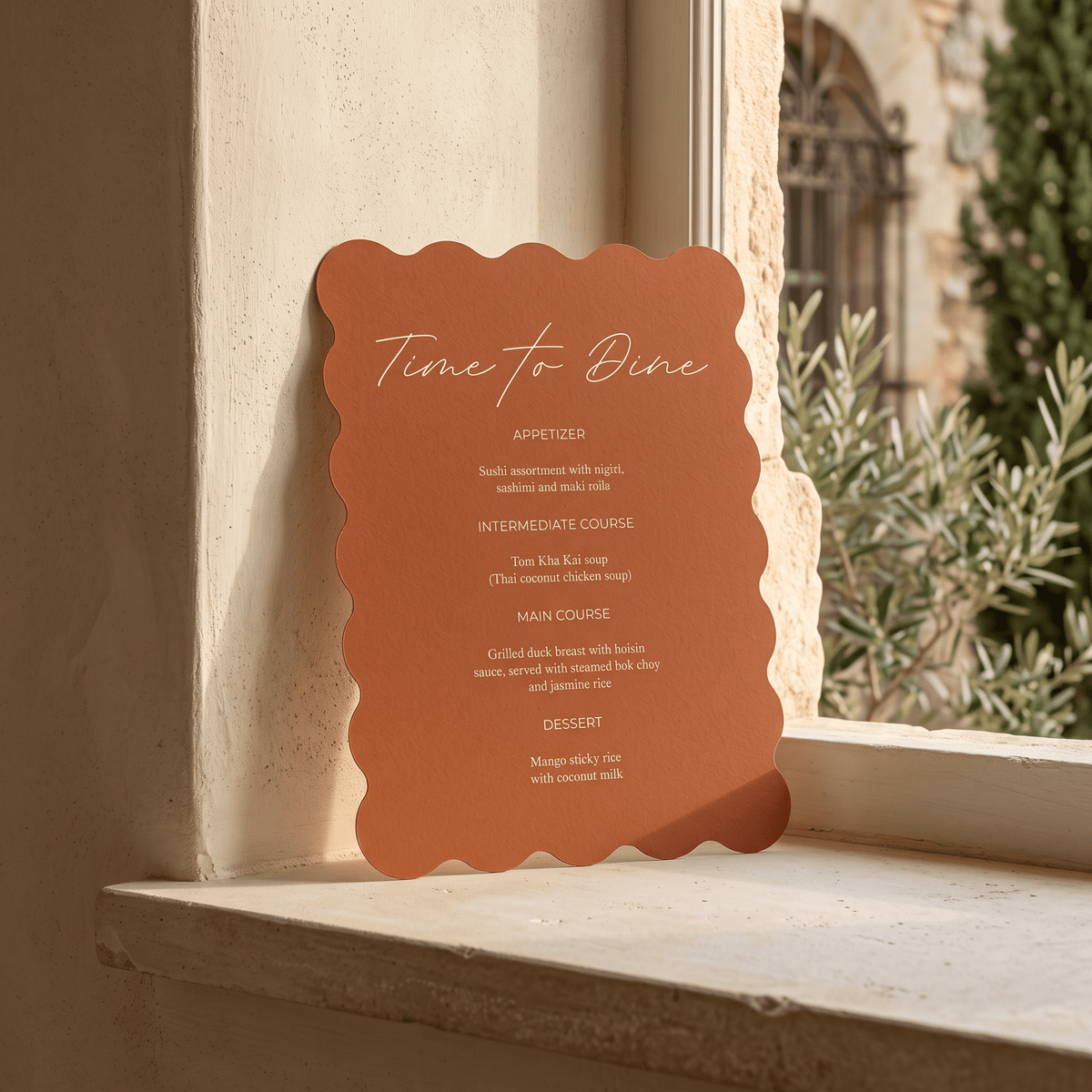 A terracotta-colored scalloped metal sign with white text reading 'Time to Dine' and a course list, displayed on a beige stone windowsill with a blurred outdoor garden background.
