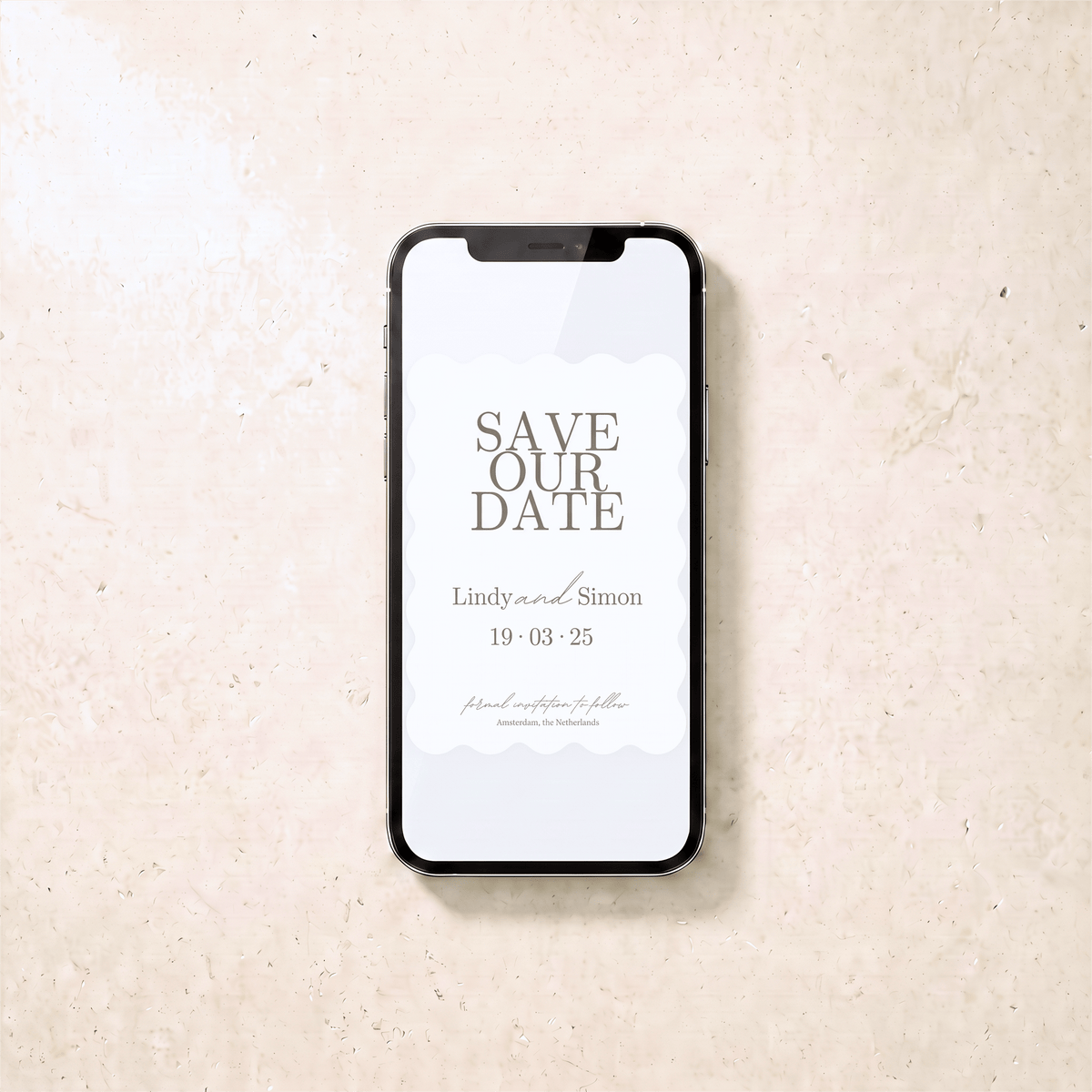A smartphone centered on a light beige textured surface, displaying a minimalist 'Save Our Date' invitation with the names 'Lindy and Simon' and the date '19.03.