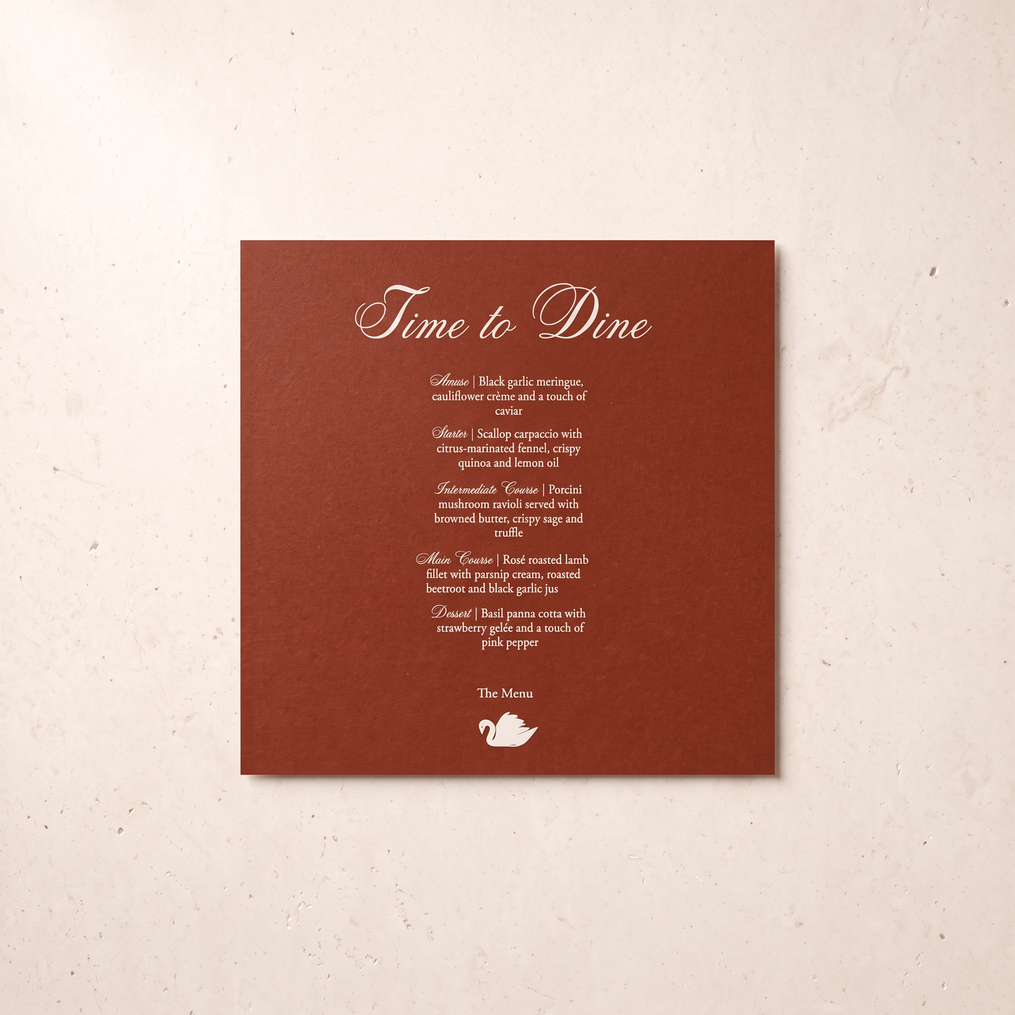 A square brown printed card with elegant white script and menu-style text reading 'Time to Dine' and a small teapot logo, photographed against a light beige textured background.